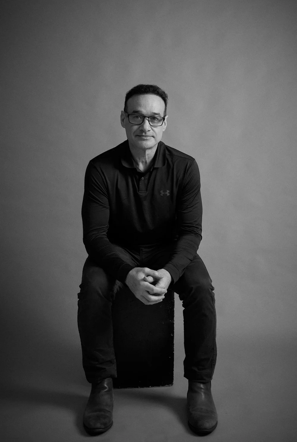 Black and white portrait of Gavin, coach behind Phoenix Momentum